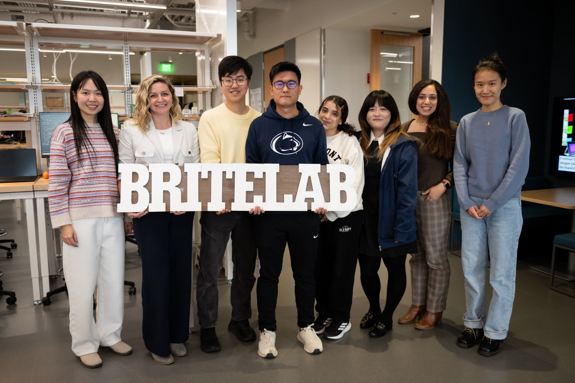 britelab team holding the lab's sign