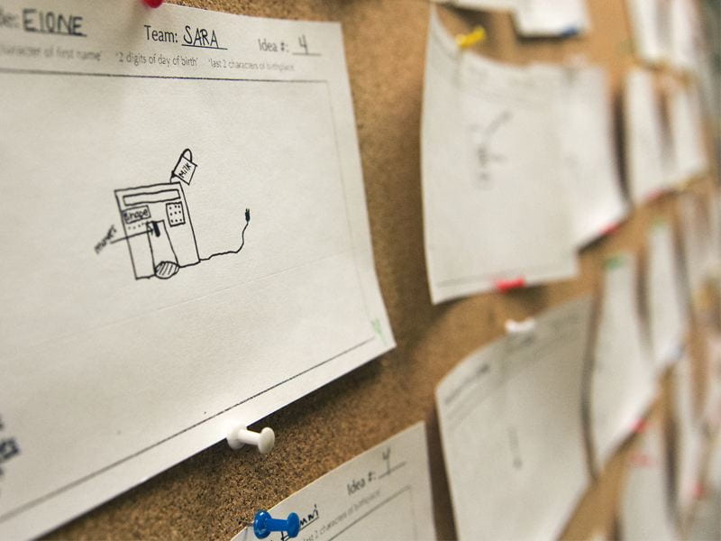 Engineering students sketching and evaluating design concepts